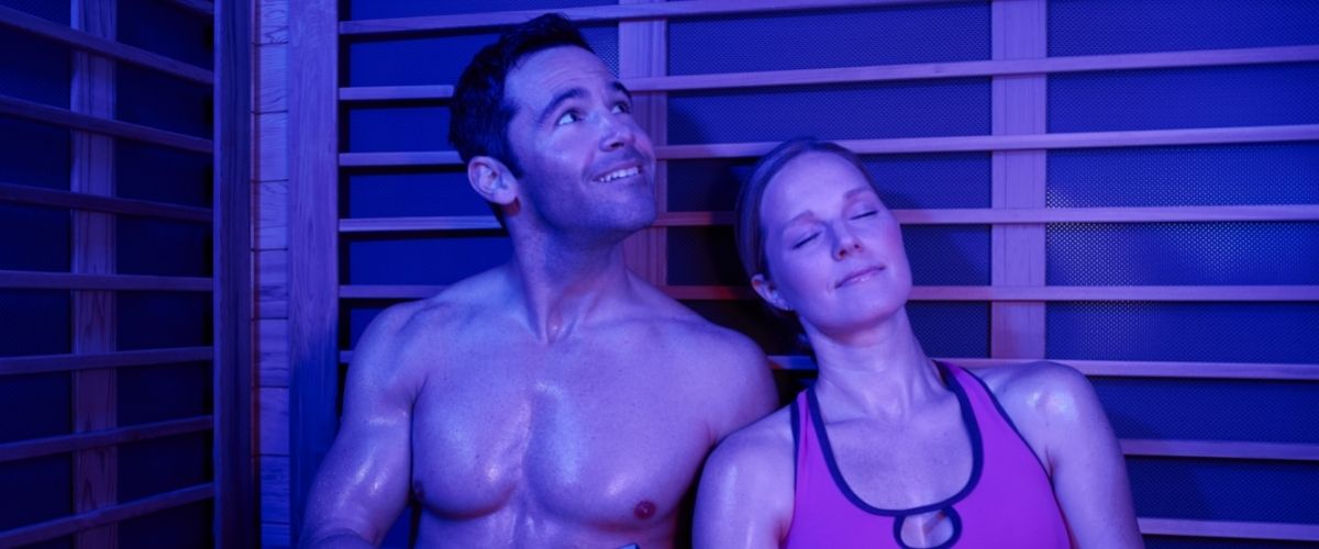 man and woman in infrared sauna